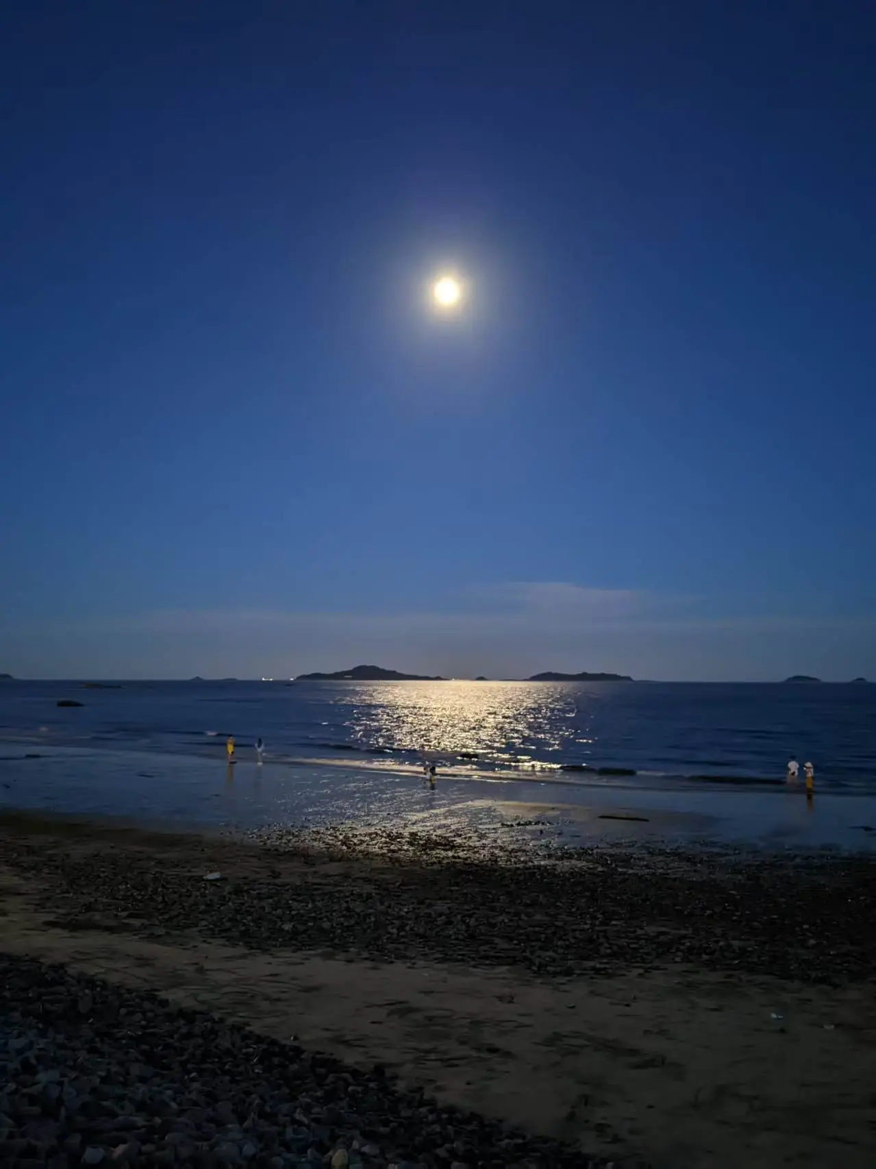 The moon over the beach by the sea